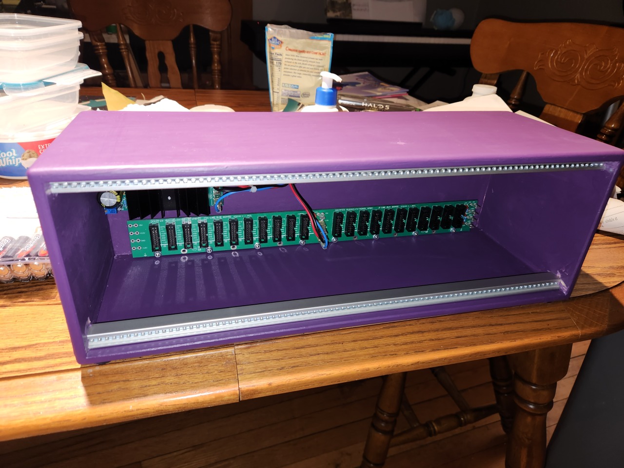 A photo of a Doepfer A-100LC3 eurorack case, painted purple.